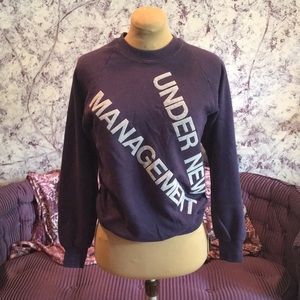 “Under new management” sweater